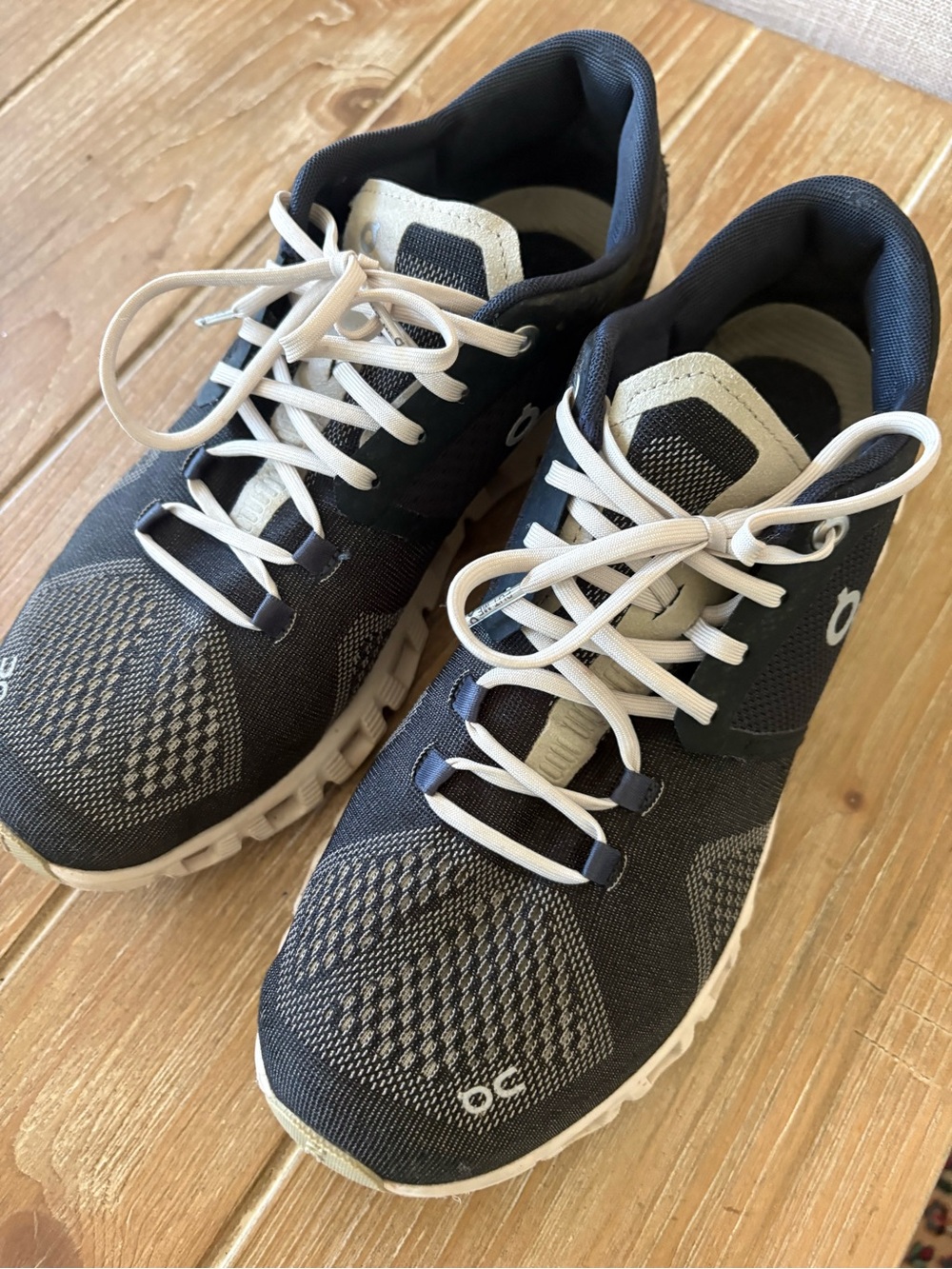 On Running Women's Athletic Sneakers in Black and Cream